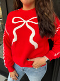 Red sweater with bow detail