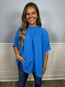 Blue mock neck top