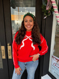 Red sweater with bow detail