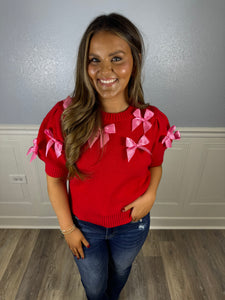 Red short sleeve sweater with pink bows