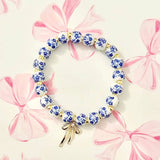 BOW CHARM FLORAL PORCELAIN BLUE BRACELET | 80B1355: Gold