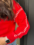 Red sweater with bow detail