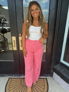 Pink distressed pearl pants