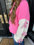 Pink color block sweater with bow detail