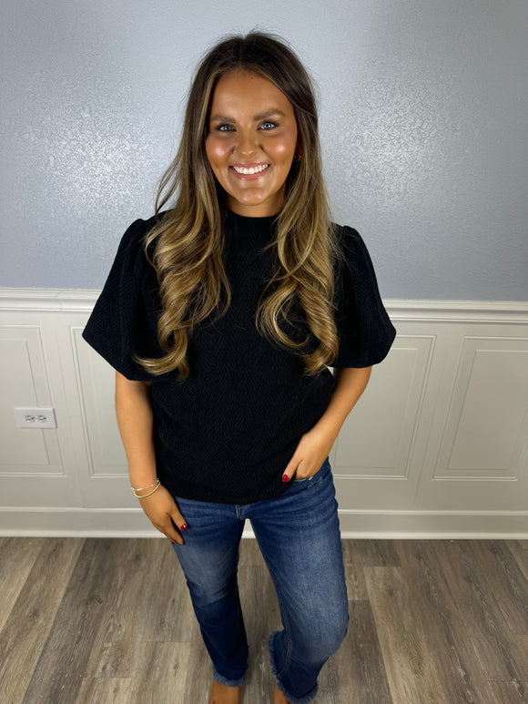 Black quilted puff sleeve top