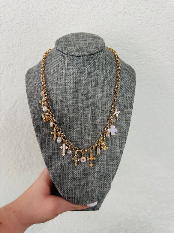 Gold cross charm necklace